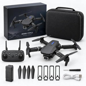 A quadcopter drone kit arranged on a white background, including the drone, carrying case, remote controller, battery, propeller guards, charging cable, and retail box. The box and case are black, and the drone body is dark gray with small blue LED accents.